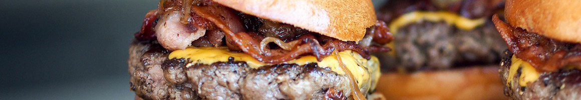 Eating Burger Greek Mediterranean at Gyrolicious restaurant in Jericho, NY.
